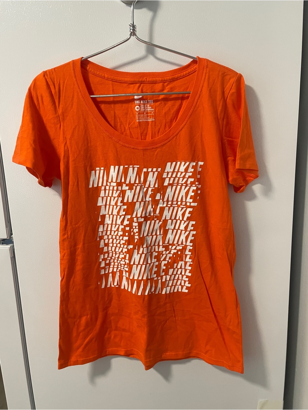 Nike Women’s Orange Short-Sleeve Scoop Neck Tee with White Graphic